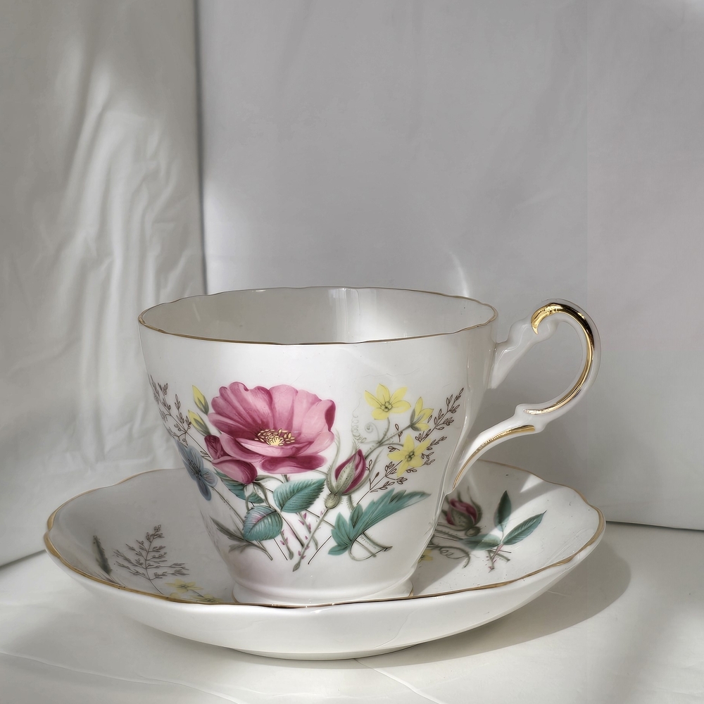 Elegant Floral Teacup and Saucer Set with Gold Trim